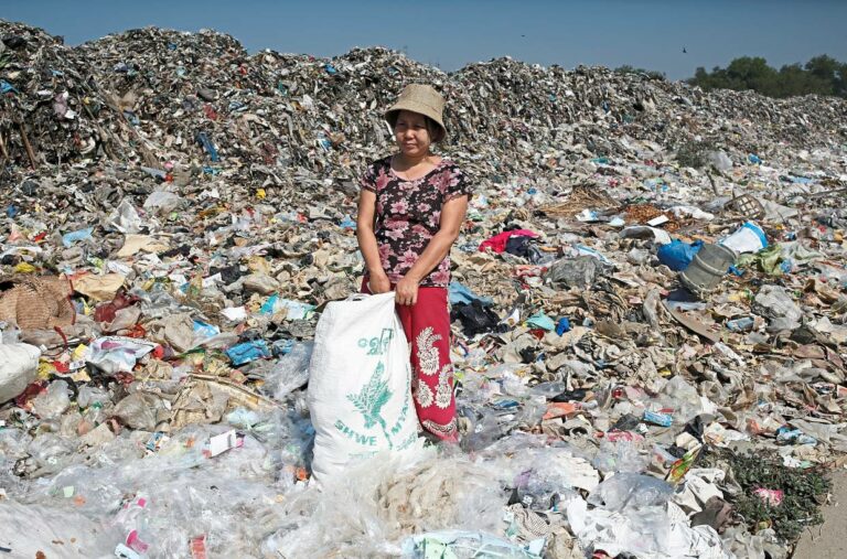 <p>Hla Hla Nwe, a staff member of the shop Chuchu House, takes a break from picking trash usable as materials to be turned into recycled products in Dalla township, Yangon, Myanmar, February 18, 2020. Picture taken February 18, 2020. REUTERS/Ann Wang</p>